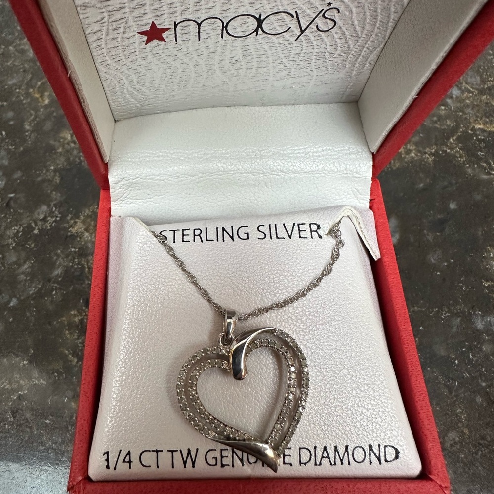 Heart necklace tiny diamond in an open heart design.